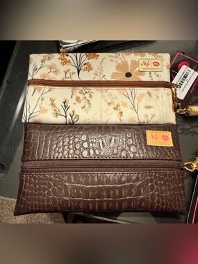 2 mini Makeup junkie bags.  Brown and cream floral